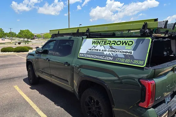 Winterrowd HVAC technician repairing HVAC system in Briargate Colorado Springs