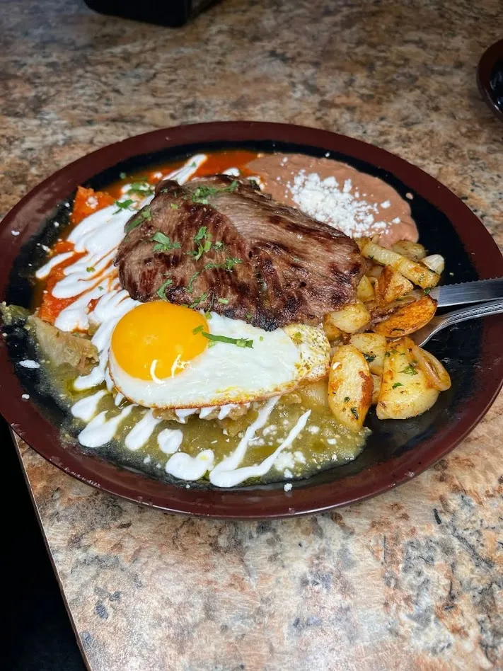 Chilaquiles with steak and egg for breakfast