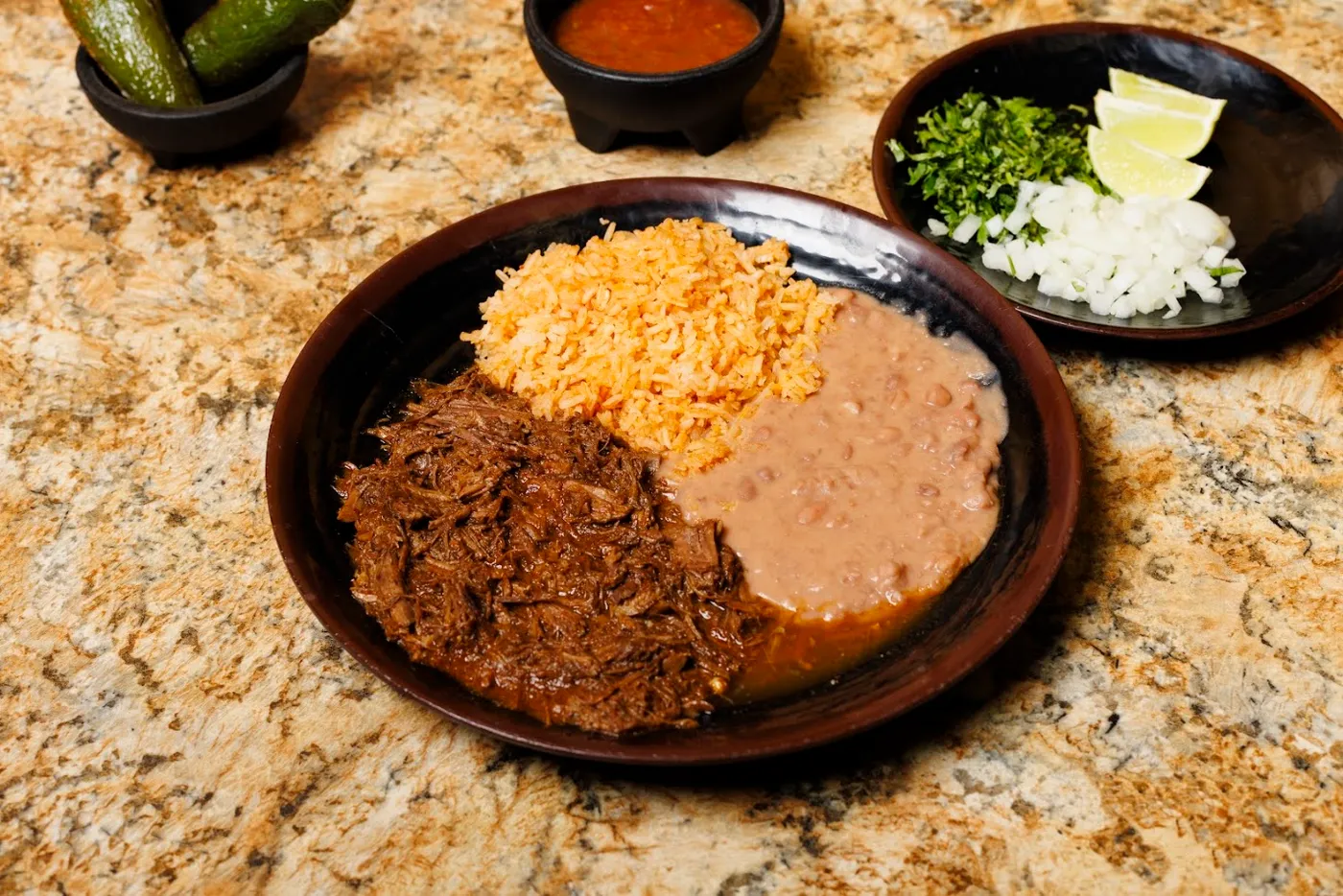 Birria combo plate with rice and beans